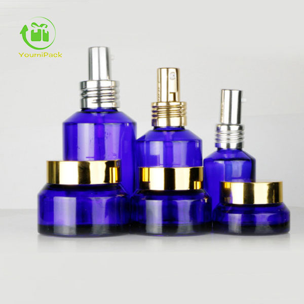 Blue cobalt glass bottles and jars set for skincare