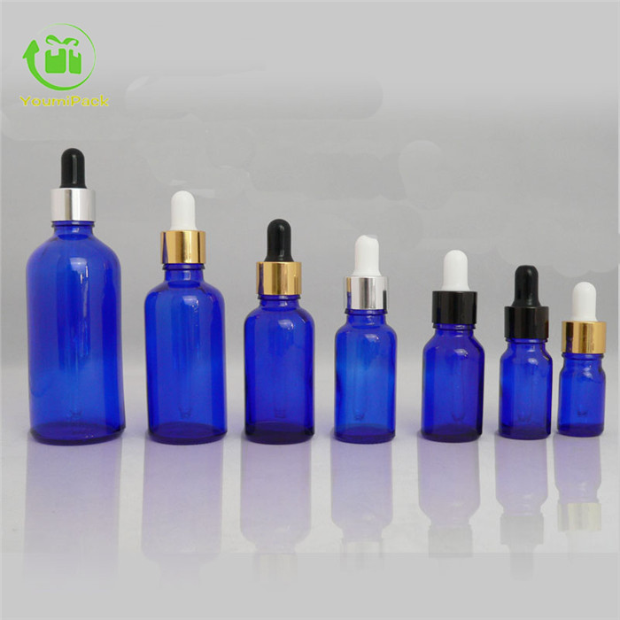 Blue glass essential oil bottle