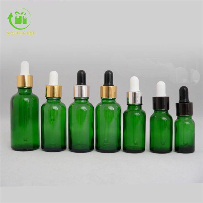 Green glass essential oil bottle